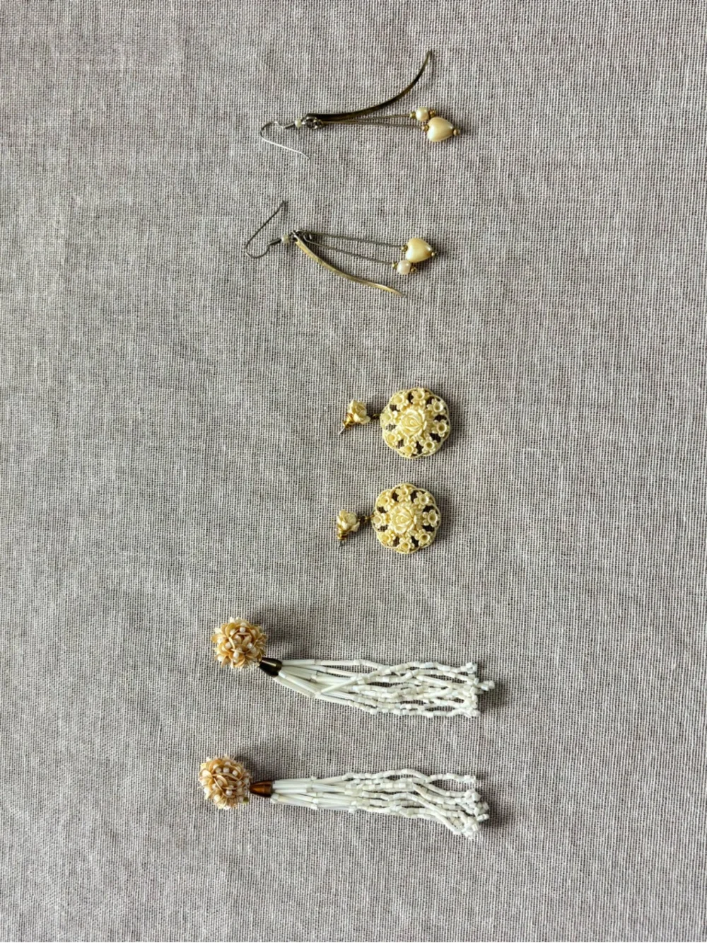 Set of three vintage cream earrings.